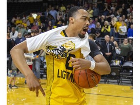 Then London Lightning's Lance Adams pulls on a championship t-shirt after beating the Windsor Express last season, but he's now the newest member of the Express.