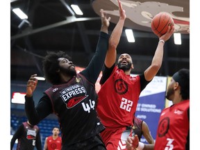 Windsor Express forward Clavin Blaydes (44) goes up in an attempt to block a shot by the Sudbury Five's Evan Harris during Sunday's game.