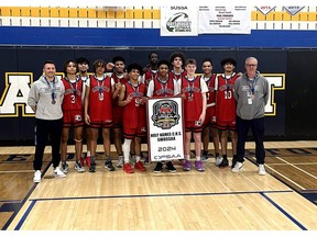 The Holy Names Knights senior boys' basketball team gathers for a team photo after taking the bronze medal at the OFSAA boys' AAA basketball championship in Stoney Creek.