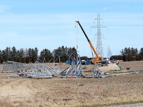 Work continues on towers for Hydro One's Chatham to Lakeshore transmission line near Bloomfield Road, south of Chatham, Thursday. The utility plans open houses seeking public input on proposed routes for its Longwood to Lakeshore project to eventually build two 500-kilovolt transmission lines. (Ellwood Shreve/Chatham Daily News)