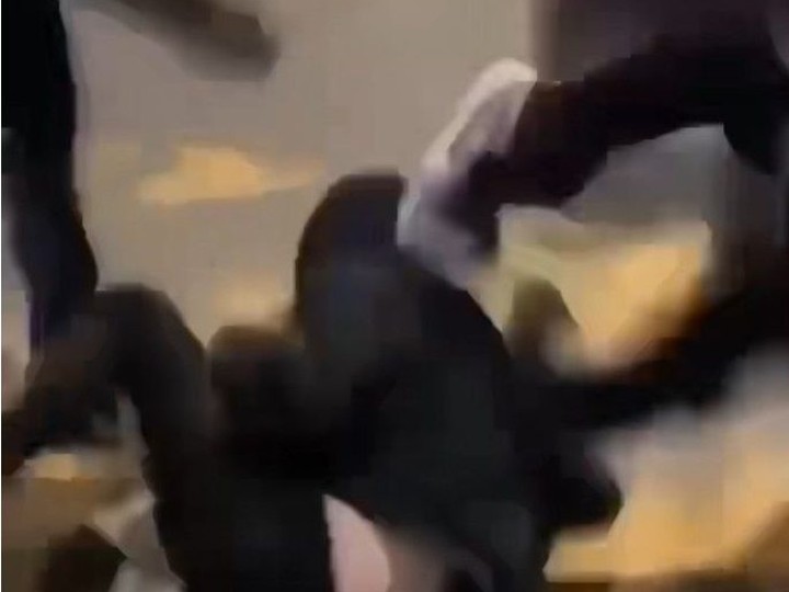  In this screen capture from a video, youths kick a boy who has autism near a bus stop at Devonshire Mall on Saturday, March 9, 2024.