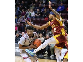 Windsor Express guard Latin Davis, left, and the Newfoundland Rogues' Armani Chaney battle for a rebound on Wednesday at the WFCU Centre.