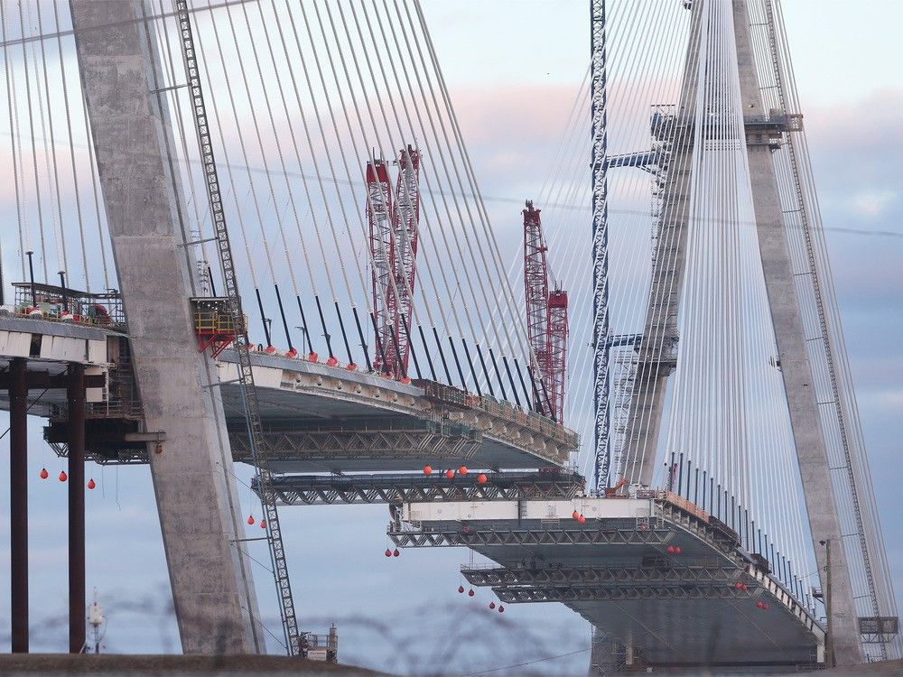 The two ends meet over the Detroit River this summer. The Gordie Howe International Bridge under construction is shown in Windsor on Thursday, Feb. 29, 2024.