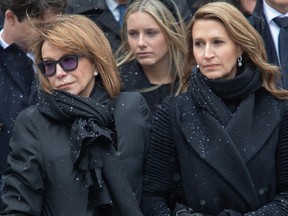 Mila Mulroney and daughter Caroline watch as the casket of Canada's 18th prime minister Brian Mulroney leaves Notre-Dame basilica in Montreal on Saturday, March 23, 2024.
