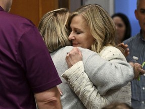 Oakland County prosecutor Karen McDonald, right, hugs Nicole Beausoleil, mother of Madisyn Baldwin, after the guilty verdict of James Crumbley, in Oakland County Court in Pontiac, Mich., Thursday, March 14, 2024. Crumbley, the father of Michigan school shooter Ethan Crumbley, was found guilty of involuntary manslaughter, a second conviction against the teen's parents who were accused of failing to secure a gun at home and doing nothing to address acute signs of his mental turmoil.