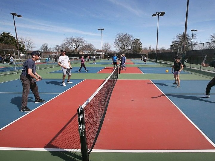  Local pickleball players take advantage of the unusually warm winter temperatures at Forest Glade Park in Windsor on Tuesday, March 12, 2024.