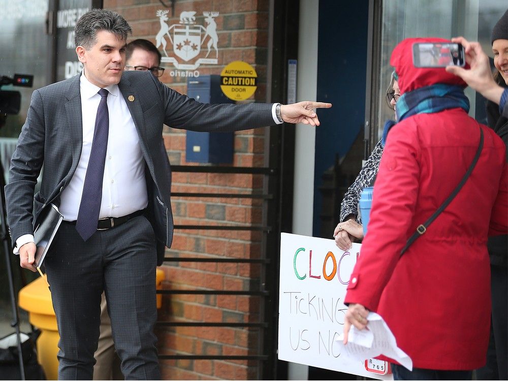 MPP Andrew Dowie speaks to rally participants at his constituency office in Windsor on March 8, 2024. Protesters demanded the re-opening of SafePoint, Windsor's consumption and treatment services site.
