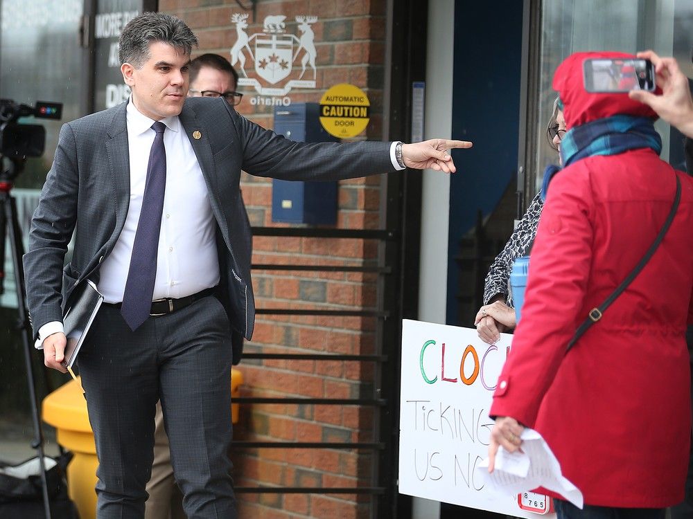 Windsor-Tecumseh MPP Andrew Dowie speaks to rally participants at his office in Windsor on Friday, March 8, 2024. The group attended to show support for SafePoint, Windsor's paused consumption and treatment services site.