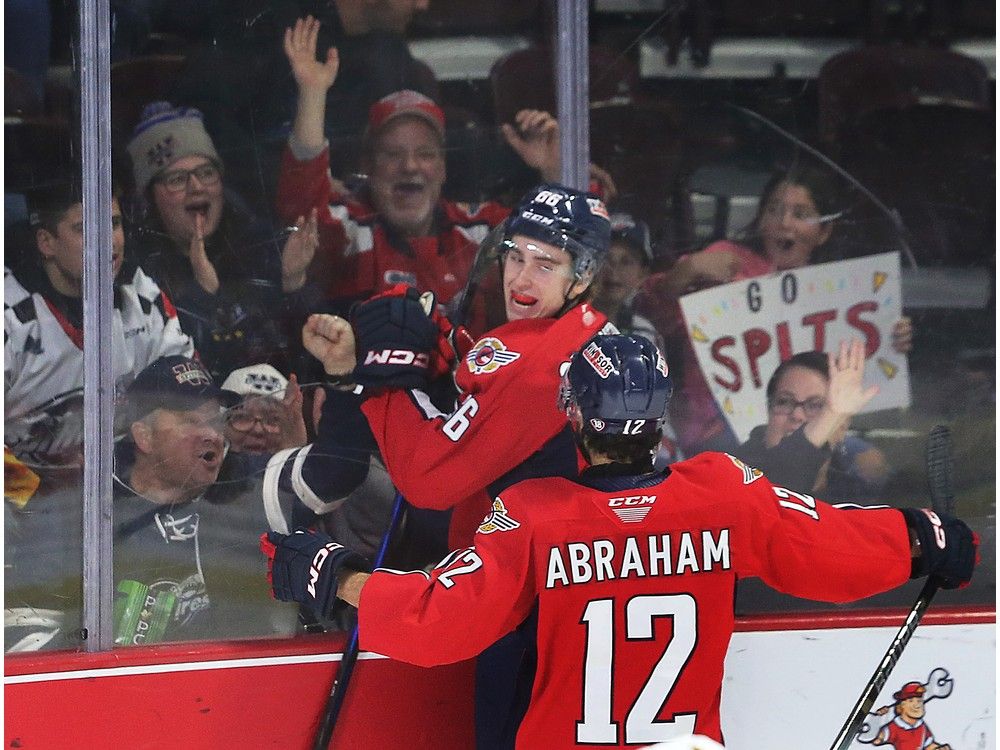 Windsor Spitfires' captian Liam Greentree and Ryan Abraham celebrate Greentree's first-period goal on Thursday.