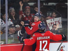 Windsor Spitfires' captian Liam Greentree and Ryan Abraham celebrate Greentree's first-period goal on Thursday.