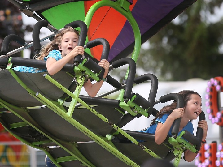  Youngsters enjoy a ride at the LaSalle Strawberry Festival on June 9, 2023.
