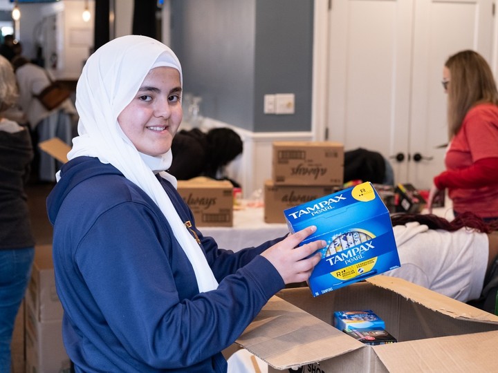  Raqayya Alawar, a volunteer at the United Way/Centraide Windsor-Essex County’s annual Tampon Tuesday event, sorts boxes of donations at the Harbour House in Windsor on Tuesday, March 5, 2024.