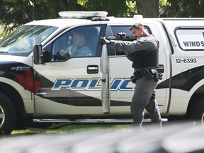 Police officer with weapon drawn