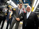Canadian Prime Minister Justin Trudeau shakes hands with Ontario Premier Doug Ford during an event at the Honda of Canada Manufacturing Plant 2 in Alliston, Ontario, on April 25, 2024 where it was announced the Japanese automaker Honda will make the largest automotive investment in Canada's history worth $15 billion.