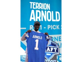 Terrion Arnold poses after being selected 24th overall by the Detroit Lions during the first round of the 2024 NFL Draft at Campus Martius Park and Hart Plaza.