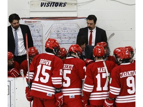Leamington Flyers' head coach Dale Mitchell talks to his players during a timeout during a road game against Georgetown last month.