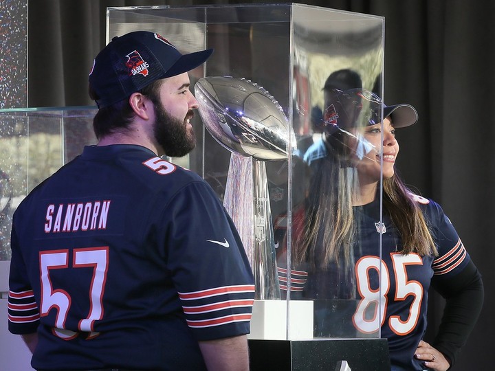 A couple gets their photo taken with the Vince Lombardi trophy at the NFL 2024 Draft in downtown Detroit on Thursday, April 25, 2024.