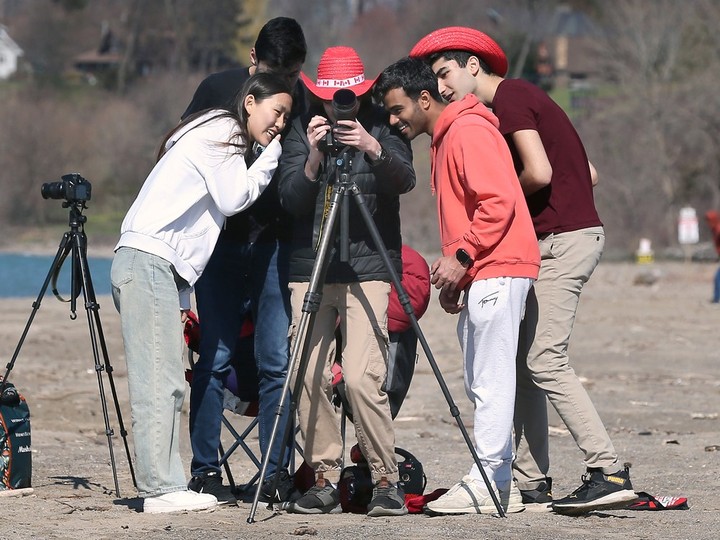  A group of students from the Waterloo area set up camera equipment on a Leamington beach on Monday, April 8, 2024, ahead of the solar eclipse. DAN JANISSE/Windsor Star