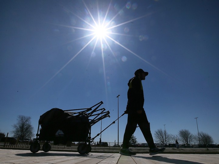  A man heads to the beach in Leamington on Monday, April 8, 2024, ahead of the solar eclipse. The municipality has closed off a number of roads, but there’s no ‘state of emergency’ as was declared in the Niagara Region ahead of anticipated huge crowds of skygazers.
