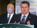 David Musyj, CEO of Windsor Regional Hospital, spoke at a press conference on the Metropolitan Campus in Windsor on January 19, 2023, listening to masked Ontario Prime Minister Doug Ford. Musyj, the local highest-ranking shareholder, paid $433,027 in 2023, while Ford's salary is $208,974.