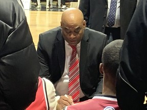 Windsor Express head coach Bill Jones goes over strategy with his players during a timeout during the club's Basketball Super League game on Thursday at the WFCU Centre.