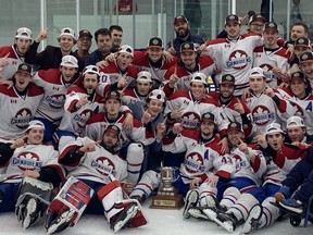 The Lakeshore Canadiens'  pose with the championship trophy after beating the Essex 73's 3-1 in Game 7 on Sunday to capture the Bill Stobbs Division championship in the Provincial Junior Hockey League at the Atlas Tube Centre.