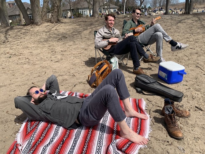  Strumming ukuleles as the Moon begins covering up the Sun over Essex County on the afternoon of Monday, April 8, 2024, at Kingsville’s Lakeside Park were visitors from the Detroit area: Ian Thompson, Zach Sutton and Jon Clark. CRAIG PEARSON/Windsor Star