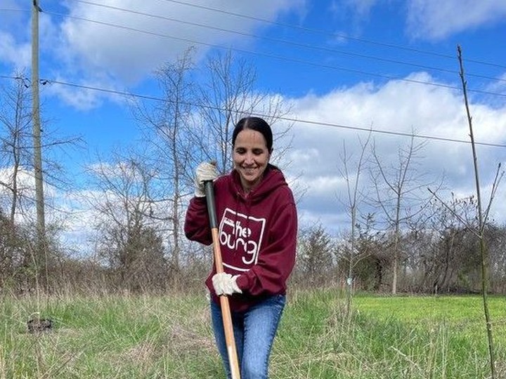  Antonietta Giofu, director of infrastructure services for Amherstburg and a member of the town’s environmental committee, plants a tree near the Libro Centre trail during an Earth Day tree planting event on Saturday.