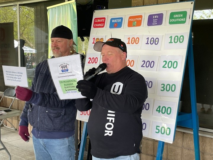  Rick Labonte, left, chair of Unifor Local 444’s environmental committee, and Shaun Fathers host a game of Environmental Jeopardy during Earth Day activities at Malden Park on Sunday.