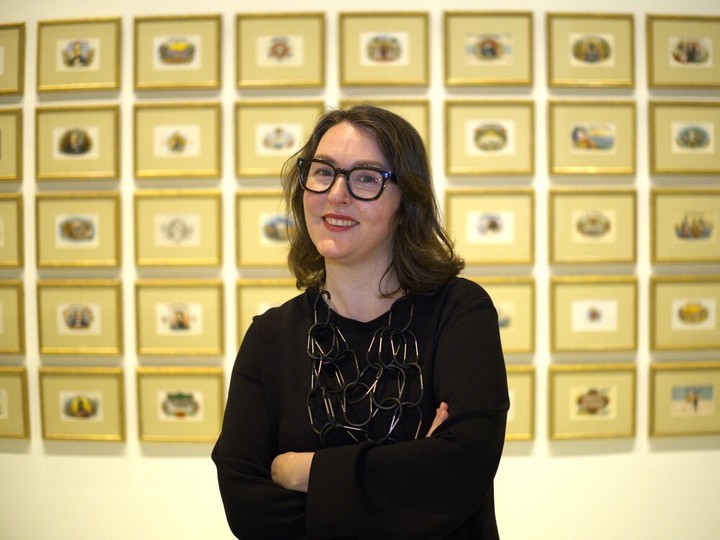  Jennifer Matotek, executive director of Art Windsor-Essex, is shown in front of a collection of vintage cigar boxes at the gallery on Wednesday, April 3, 2024.