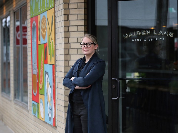  Sarah Dewar, co-owner of Maiden Lane Wine and Spirits, shown in front of the downtown establishment on Wednesday, April 17, 2024, would like more support for downtown businesses suffering vandalism.