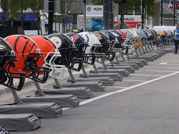  NFL team helmets line Jefferson Avenue in downtown Detroit on Wednesday, April 24, 2024 for the upcoming NFL draft.
