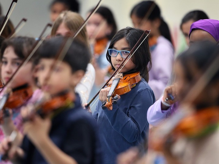  Students participate in a “String Project” performance at Frank W. Begley Public School in Windsor on Wednesday, April 17, 2024.
