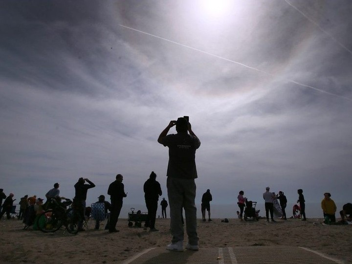 Crowds gathered along the Lake Erie shoreline on a warm and not-terribly-cloudy Monday afternoon at Seacliff Beach in Leamington to witness an exceedingly rare celestial event. They were the first Canadians to enjoy the April 8, 2024, total solar eclipse. DAN JANISSE/Windsor Star