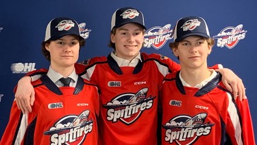 Windsor Spitfires' third-round pick Andrew Robinson, at left, is joined by second-round picks Carter Hicks, centre, and J.C. Lemieux, at right, as the trio arrived at the WFCU Centre on Saturday after being selected in the Ontario Hockey League Draft. (WINDSOR STAR - JIM PARKER)