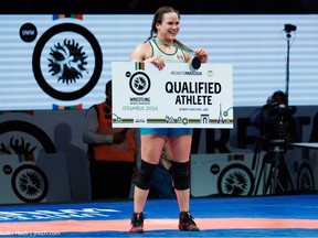 Tecumseh's Linda Morais holds her bronze medal and card showing her a qualified athletes for the Paris Olympic Games after competition at the World Olympic Wrestling Qualifier. Morais will compete in the women's 68kg division.
