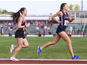Cardinal Carter's Sian Kniaziew, right, leads Massey's Layla Masse during the senior girls' 1,500 metres at the SWOSSAA track and field championship. Kniaziew won the event in 4:52.76 while Masse finished third.