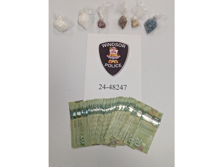  Windsor police display drugs and money they allege were found in the possession of a 22-year-old man.