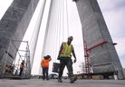 Workers are shown on the deck of the Gordie Howe International Bridge on Tuesday, May 14, 2024 during a media tour.
