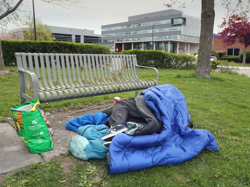 On the same day Windsor leaders announced a new initiative to revitalize the downtown &mdash; including measures to address homelessness &mdash; a man sleeps near City Hall on Tuesday, April 23, 2024.