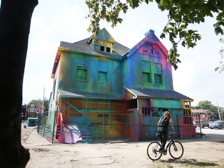  The dilapidated house on Ouellette Avenue just south of downtown Windsor is shown on Sept. 11, 2023, after local artists volunteered their time to give it a colourful makeover. DAN JANISSE/Windsor Star