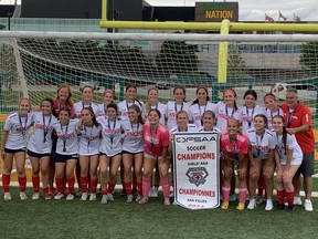 The Holy Names Knights pose with the championship banner after Saturday's  2-0 win over St. Thomas Aquinas in the gold-medal game at the OFSAA girls' AAA soccer championship, which was played at Acumen Stadium.
