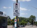On Thursday, June 6, 2024, the drivers provide signs at the intersection of Tecumseh Road West and Huron Church Road in Windsor.