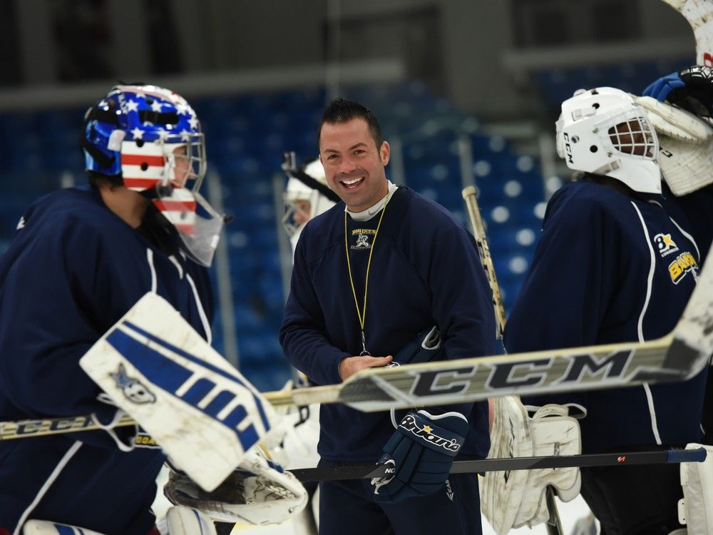 Windsor native Stan Matwijiw, centre, is, seen working with prospects at his Bandits Goalie School. Matwijiw has joined the Windsor Spitfires as the team's goalie coach.