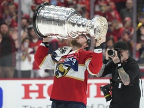 Florida Panthers right wing Vladimir Tarasenko, who signed a two-year deal with the Detroit Red Wings on Wednesday, kisses the Stanley Cup after helping the Florida Panthers to the title.