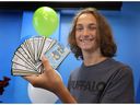 Nathaniel Prange displays his board game cards at the Small Business and Entrepreneurship Centre in Windsor on Tuesday, August 27, 2024. He is one of 15 student entrepreneurs being recognized for launching small businesses in the Windsor-Essex area.
