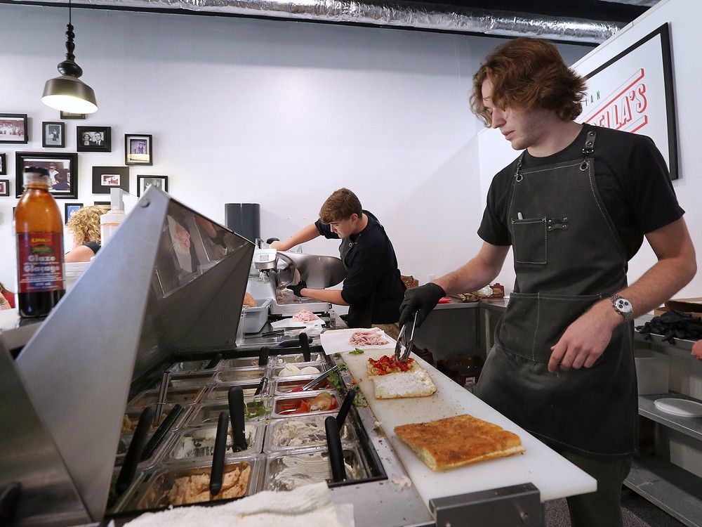  wilson bortolin, left, and charlie bortolin prepare sandwiches at petrella’s italian street food on drouillard road in windsor on friday, aug. 30, 2024.