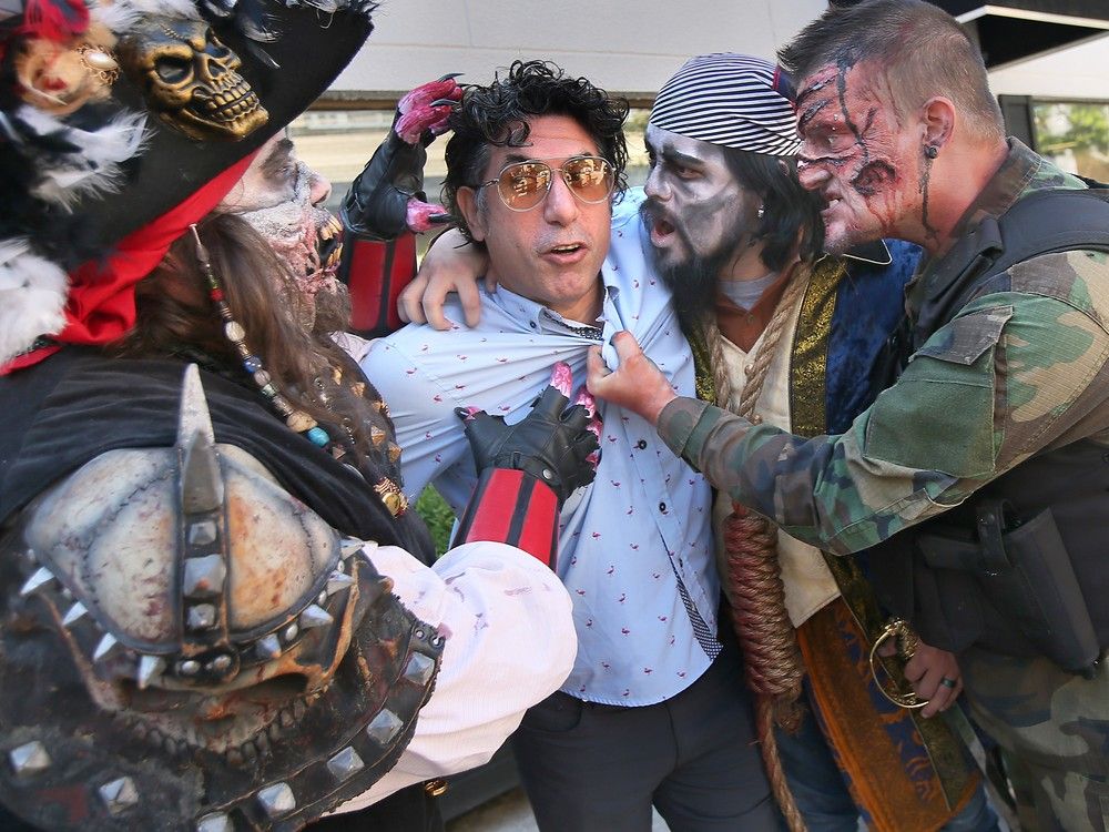 windsor ward 3 coun. renaldo agostino meets some colourful characters at a press conference on tuesday for the upcoming zombie walk and parade.