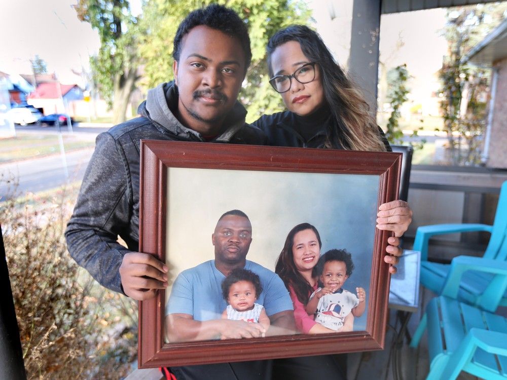 'Devastated.' Christian Grey and his mother Rose Grey pose with a family photo on Friday, Dec. 6, 2024, in Windsor. The family is seeking answers after Rose's husband and Christian's father, Colin Grey, was recently held for hours by CBSA officers at the Ambassador Bridge and then Windsor police, before dying from an untreated diabetic episode outside police headquarters.