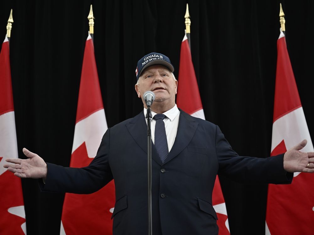 Ontario Premier Doug Ford, wearing a 'Canada Is Not For Sale' hat, speaks as he arrives for a first ministers meeting in Ottawa on Wednesday, Jan. 15, 2025.